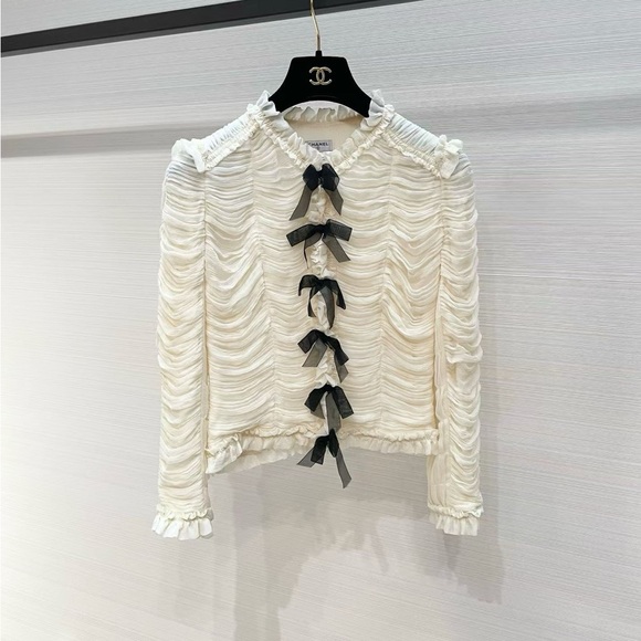 CHANEL Pants - CHANEL Cream Ruffled Long-Sleeve Blouse with Black Bow Accents